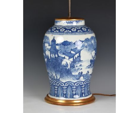 A large Chinese blue and white vase lamp, the vase probably 19th century, of stout baluster form, painted with a mountainous 