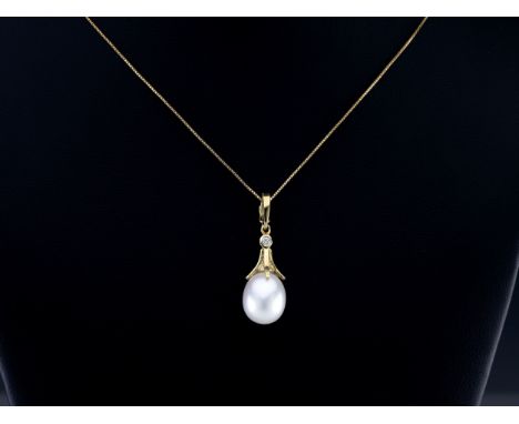 An 18ct gold, diamond and pearl pendant, the 1.2 x 1.0cm. pearl suspended from a claw, bezel-set with a brilliant diamond on 