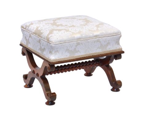 A William IV rosewood box footstool, the box top with hinged lid, in ivory floral damask upholstery, raised on shaped x-suppo