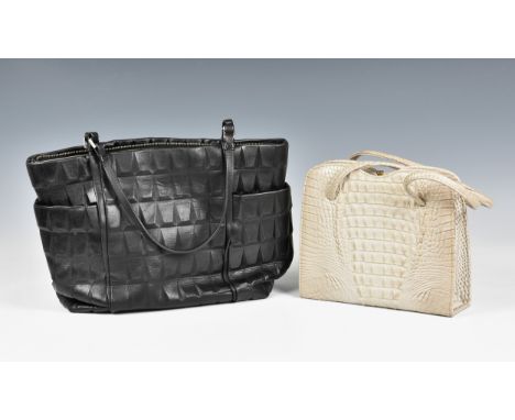 A Calvin Klein shoulder bag, in black calfskin with an unusual facet quilted design, with two outside end compartments and to