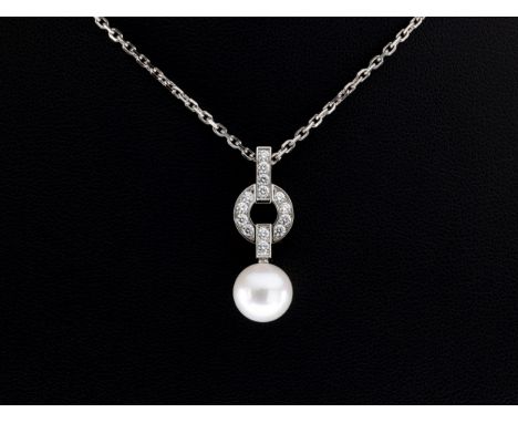 A cultured pearl and diamond pendant necklace, by Cartier, the 9 x 9mm. pearl suspended from a brilliant cut diamond set surm