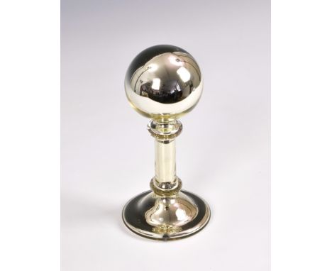 A rare mercury glass wig stand, of typical form with spherical head, wax seal to underside, 8in. (20.3cm.) high. * Light surf