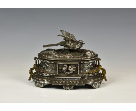 Jules Moigniez (French, 1835-1894), a 19th century silvered and parcel gilt bronze jewellery casket, signed 'J. Moigniez', in