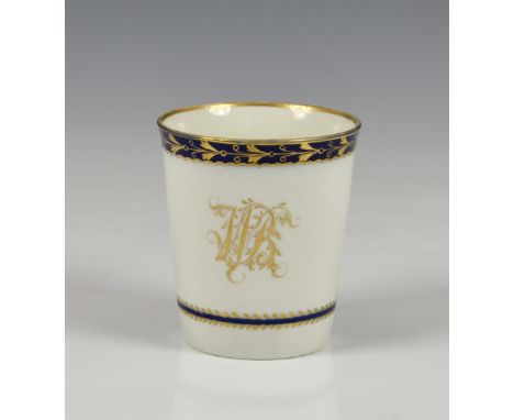 An early 19th century Worcester beaker, of plain, tapered form with cobalt blue and gilt foliate borders and gilt monogram, s