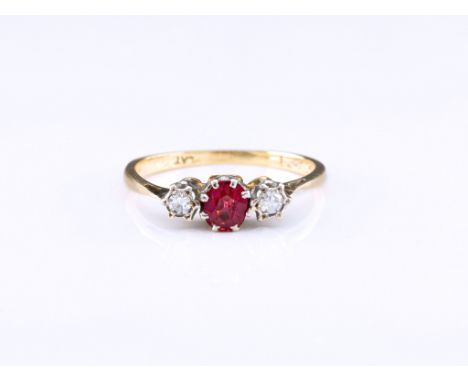 An 18ct gold, ruby and diamond trilogy ring, the round cut ruby of pinkish red colouring, in an 8 pronged platinum setting be