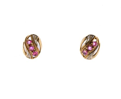 A pair of 9ct gold and ruby earrings, each of openwork, oval form with a trio of round-cut rubies, with post backs for pierce