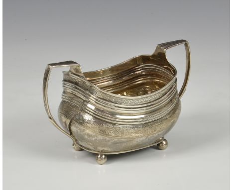 A George III silver twin handled sucrier, Alice &amp; George Burrows, London, 1805, of bellied oval form, having reeded and f