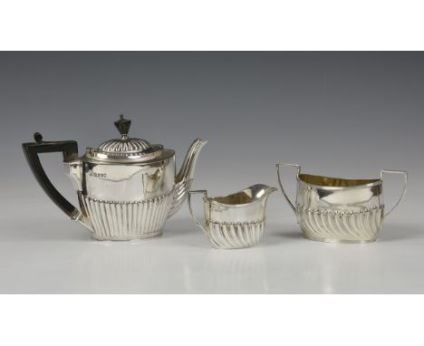 A Victorian matched silver three piece bachelors tea service, comprising a teapot, jug &amp; twin handle sugar basin, the tea