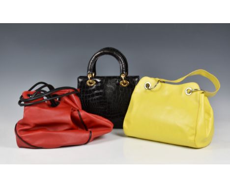 A Russell &amp; Bromley black crocodile effect leather bag, in the style of the Christian Dior 'Lady Dior' bag, with top hand