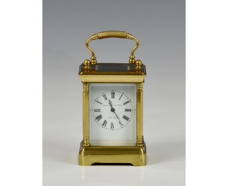A miniature brass carriage clock by Elliott &amp; Son, London, 20th century, with five bevelled glass panels, a white enamel 