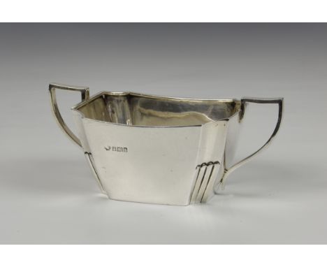 An Edwardian silver twin handled sugar basin, William Hutton &amp; Sons Ltd, Sheffield, 1910, of rectangular pinched stylised