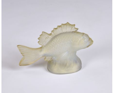 A relief moulded opalescent glass fish in the style of Lalique, faint raised mark 'Ver Pryo' France, 6in. (15.2cm.) long. * L