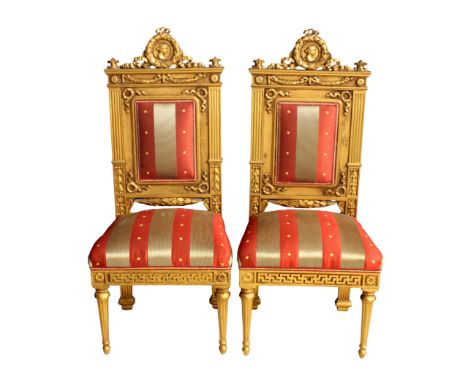 A pair of French Empire style neo-classical giltwood side chairs,&nbsp;late 20th century, the rectangular padded backs with l