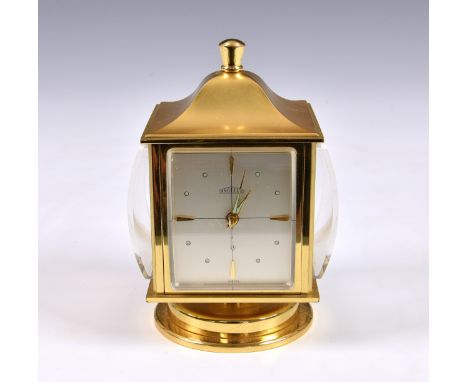 An Angelus desk compendium weather station, with rotating brass body with clock, barometer, thermometer and hydrometer, havin