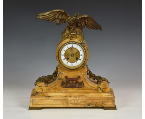 A late 19th century French Sienna marble and ormolu mounted mantel clock, the drum case surmounted by an eagle with outstretc