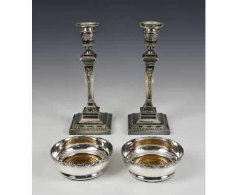 A pair of elegant weighted silver plate classical style candlesticks, of tapering square form with urn style sconce and remov