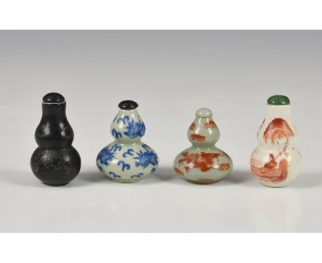 Four Chinese porcelain double gourd snuff bottles, probably 20th century, of varying forms and colours, decorated with bats, 