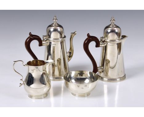 A matched Elizabeth II silver bachelor's four piece coffee set, coffee pot and hot water pot by Walker &amp; Hall, Birmingham