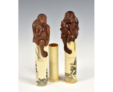 A matched pair of Japanese boxwood okimonos / scroll holders of monkeys, early 20th century, each depicting a monkey &amp; it