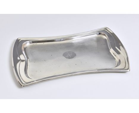 An Art Deco silver dressing table tray, Hasset &amp; Harper Ltd, Birmingham, 1921, of waisted rectangular form, the centre wi
