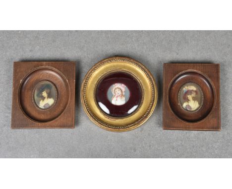 Three early 20th century portrait miniatures, comprising a pair, of 18th century ladies, watercolour on ivorine in wooden fra