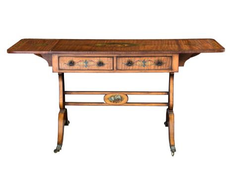 A fine 19th century Sheraton Revival painted satinwood sofa table, the rectangular dropflap top with rounded angles and paint