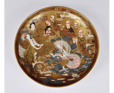 A Japanese Satsuma circular dish or charger, probably Meiji period (1868-1912), signed with large ochre and gold seal mark, d