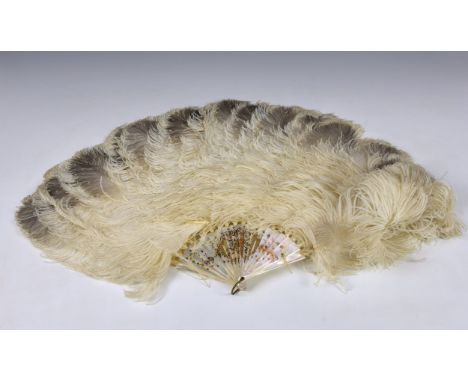 Large 19th century white ostrich feather fan with mother of pearl sticks, highlighted in fancy gilt decoration, approx. 30 ¼i