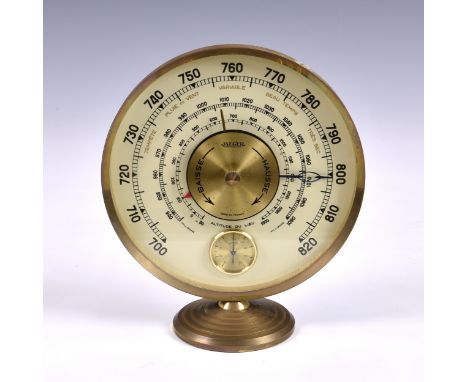 A vintage Jaeger desk weather station, the brass circular rim supporting glass dial with barometer, altitude and milibars the