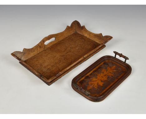 An unusually small 1920s pokerwork tray, of rectangular oval form with turned bobbin handles, the upper surface with central 