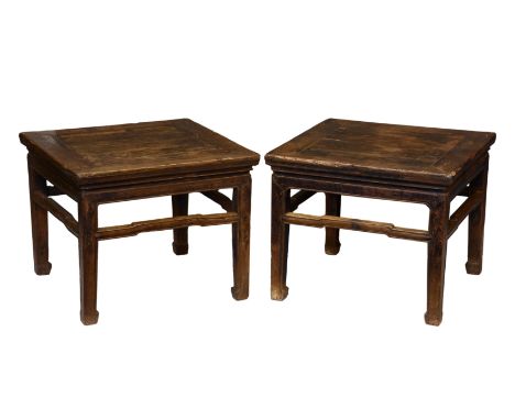 A pair of Chinese stained elm square low tables, probably 19th century, probably originally lacquered, one stretcher to each 