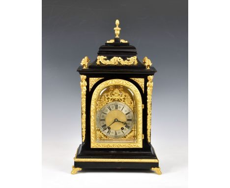 A 19th century ebonised and gilt metal mantel clock, the twin train movement numbered 4581, striking the hours on a gong, fro