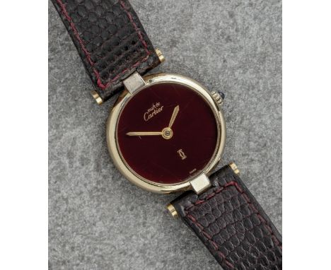 A Cartier Must de Cartier ladies vermeil watch, No. 18012552, the circular 23.5mm. case with blue cabochon crown, signed case