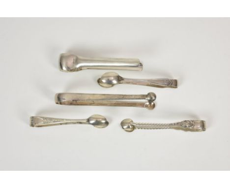 A collection of various silver sugar tongs, comprising a George III pair of slender form with round shell bowls and inscribed