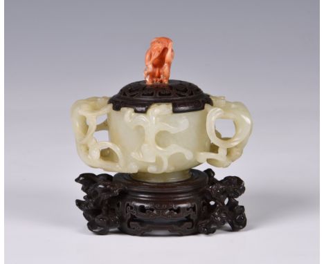 A Chinese carved pale celadon jade chilong cup, probably Qianlong period (1736-1795), the vessel carved with a short, stepped