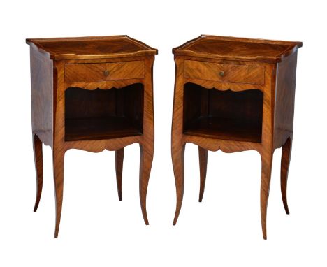 A pair of French 19th century rosewood serpentine bedside cabinets, the quarter veneered three-quarter tray tops over a singl