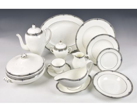 A Wedgwood 'Amherst' dinner service for six, including two covered tureens; meat plate; gravy boat and tray; coffee pot; jug;