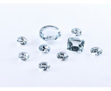 Nine loose aquamarines, of various saturation and size, oval-cut and step-cut. (9). 