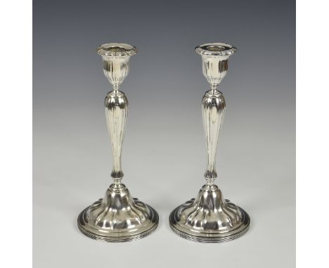 A pair of Edwardian silver candlesticks, Atkin Brothers, Sheffield, 1910, of naturalistic elliptical form, having removable s