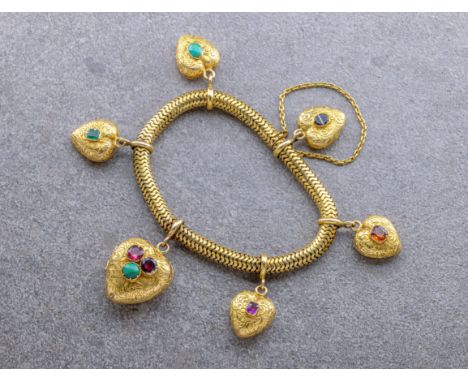 A Victorian flexible gold bracelet with gem set heart charms, set with 18ct and 15ct gold, each heart with floral chased deco