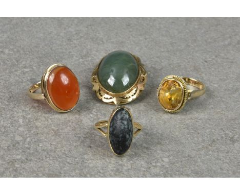 Three yellow gold gem set rings, one  in 14ct gold with an oval cut citrine; one 9ct with a cabochon agate; the third 9ct wit