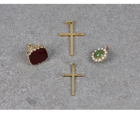 A 19th century style 9ct gold and carnelian fob seal, hallmarked Birm. 1971, 19mm. long; together with two cross pendants in 