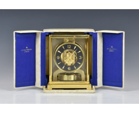 A Jaeger-LeCoultre "Atmos" mantel clock, Swiss, late 20th century, with brass and glass case of rectangular form, black chapt