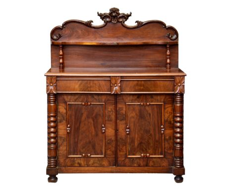 A Victorian Channel Islands mahogany chiffonier, the shaped back with foliate cresting and serpentine shelf on baluster turne