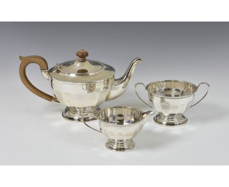 A George V silver three tea service, Alexander Clark &amp; Co Ltd, Birmingham, 1931, of demi-panelled pedestal form, comprisi