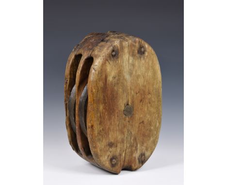 A large 18th century or earlier wooden twin pulley block, of typical elm construction with twin lignum vitae roller wheels, w