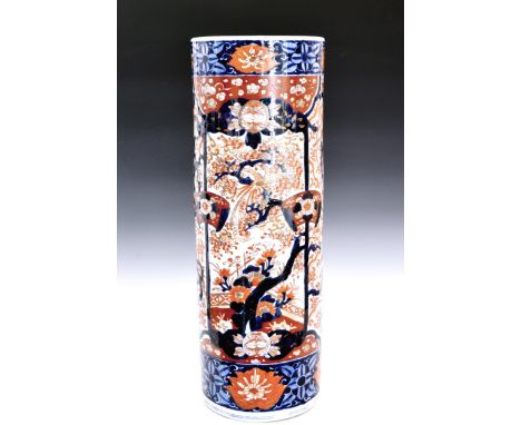 A Japanese Imari cylindrical stick stand, probably late 19th century, typically decorated in traditional pallet, depicting ph