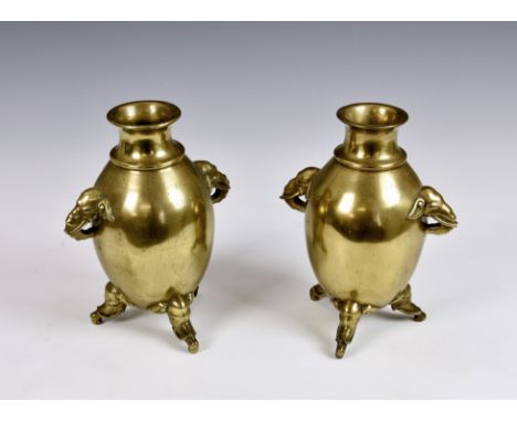A pair of Chinese bronze 'Elephant' vases, Qing Dynasty, the high globular body with a lipped waisted neck and everted rim, t