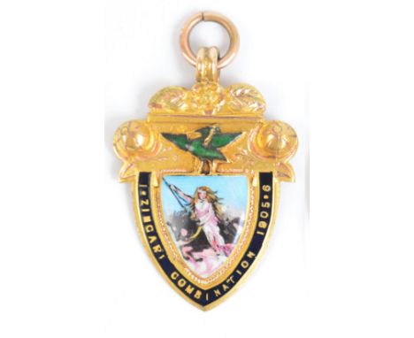 A rare Edwardian 9ct gold and enamel decorated football medal for the Zingari League, the shield shaped enamel central plaque