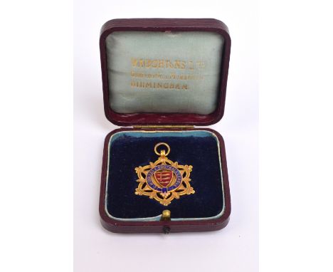 Middlesex Football League; a 9ct gold and enamel medal inscribed “Premier Winners 10-11”, in original fitted case with gilded